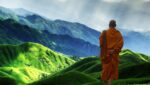 A Tibetan monk looking at the mountains